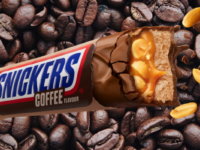 Snickers Coffee flavour bar with a backdrop of coffee beans