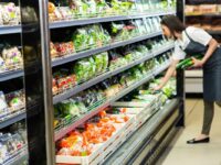 a woman works at a supermarket