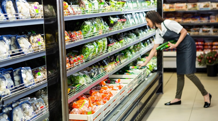 a woman works at a supermarket
