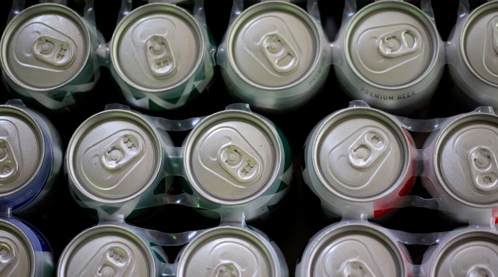 Beer cans are displayed in a store