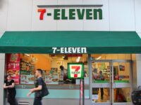 People walk in front of 7-Eleven store in New York