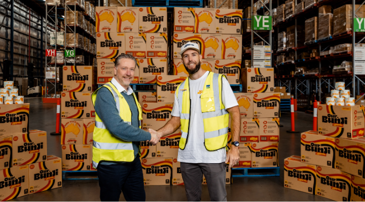 Yarnn Lane Stockton shakes hand with Bunzl executive.