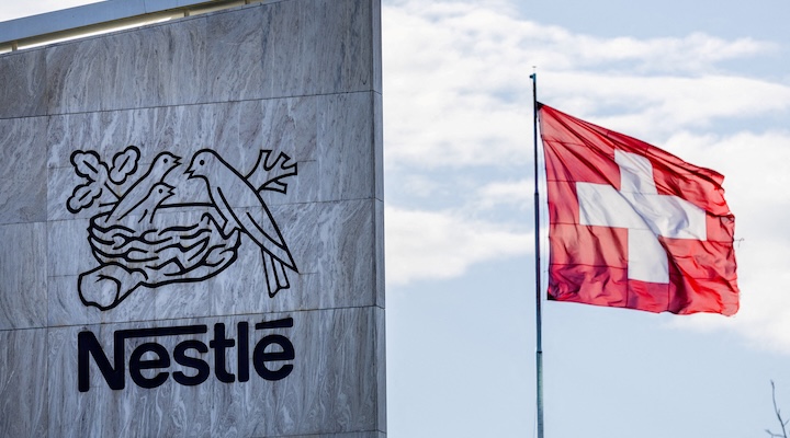 Swiss flag flutters on the headquarters of Nestle
