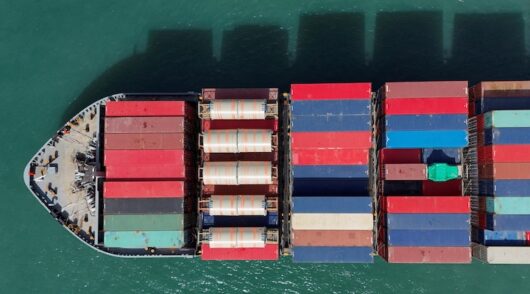 A drone view shows a cargo ship