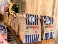 A person handles Pick n Pay grocery bags