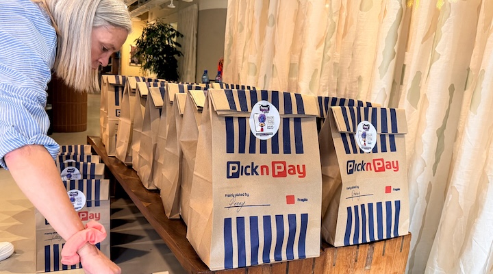 A person handles Pick n Pay grocery bags