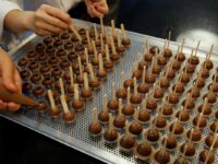 Empoyees of chocolate and cocoa product maker Barry Callebaut prepare chocolates