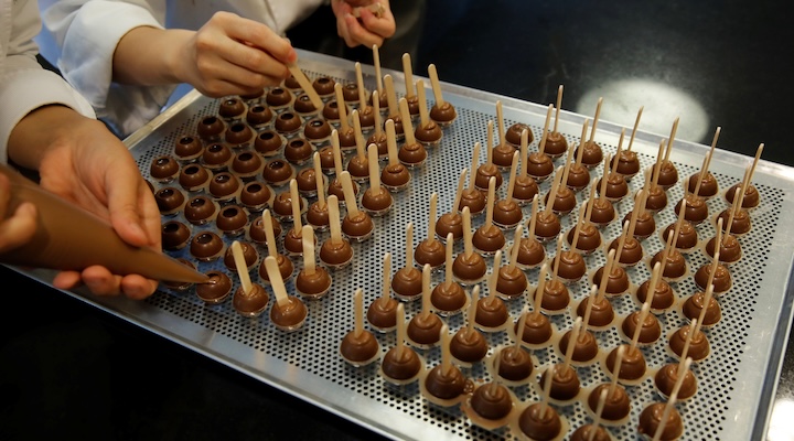 Empoyees of chocolate and cocoa product maker Barry Callebaut prepare chocolates