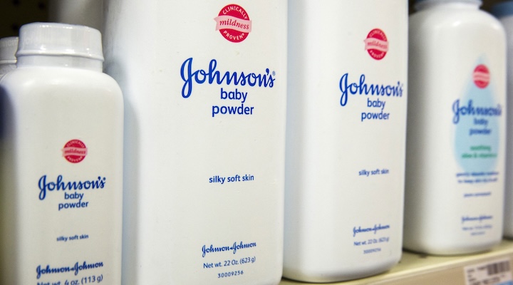 Bottles of Johnson & Johnson baby powder line a drugstore shelf