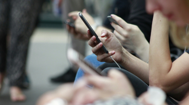 people on their phones