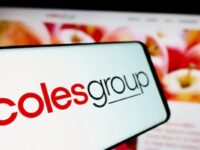 Mobile phone with logo of Australian retail company Coles Group