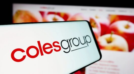 Mobile phone with logo of Australian retail company Coles Group
